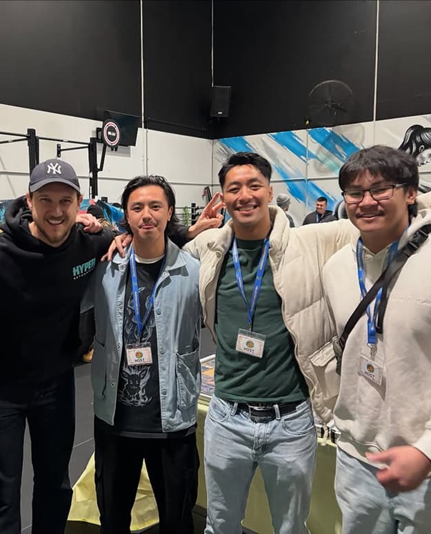 Four people posing together at a Collector’s Paradise event